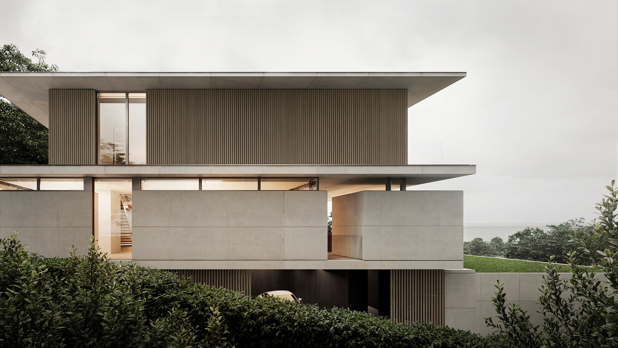 SMALL ASH casa con fachada de wall panel exterior