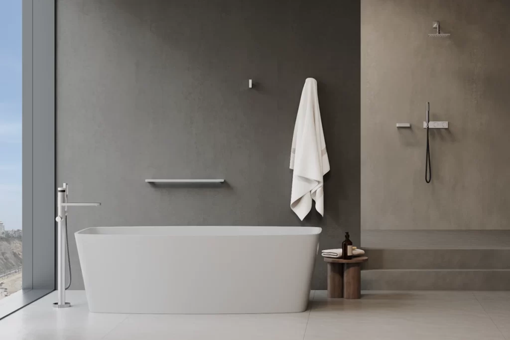 baño con paredes de color neutro y accesorios de baño minimalistas de acero inoxidable